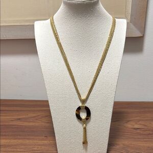 Coldwater Creek Signed 7 Strand GoldTone Necklace with Amber Colored Pendant.